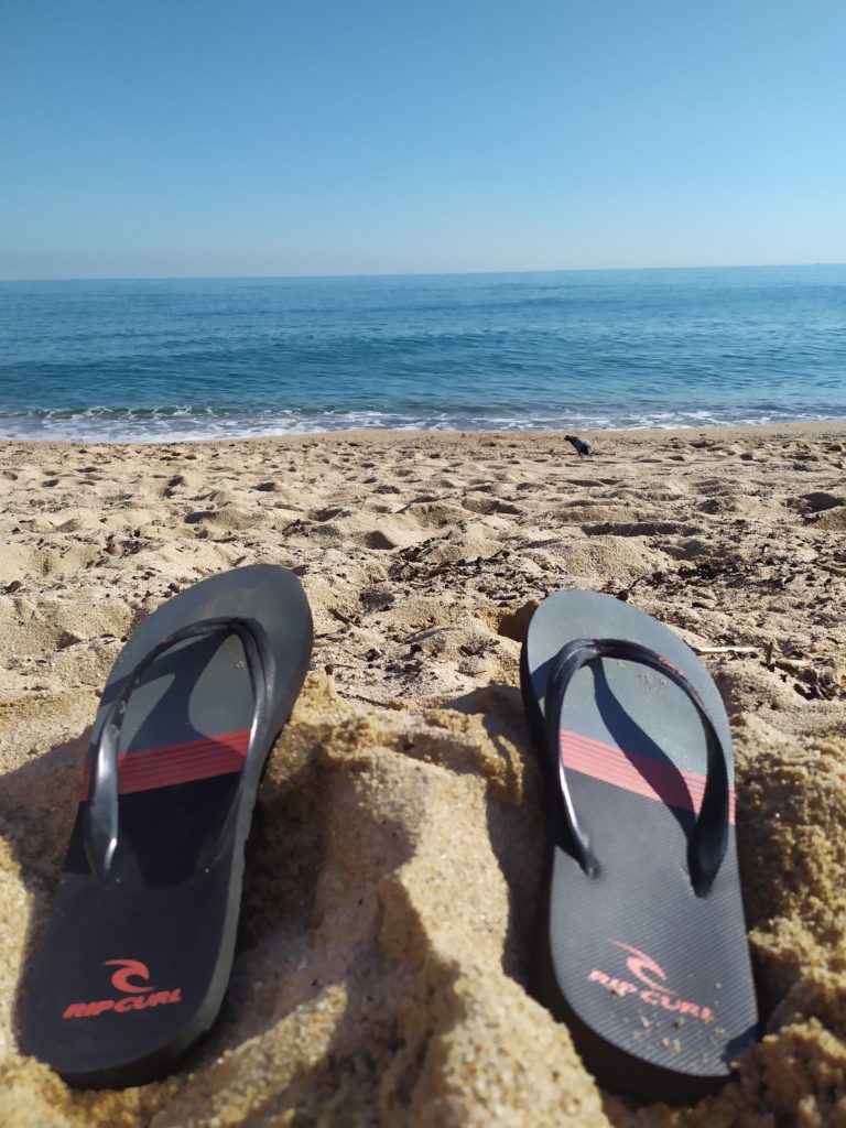 Sandals in beach sand